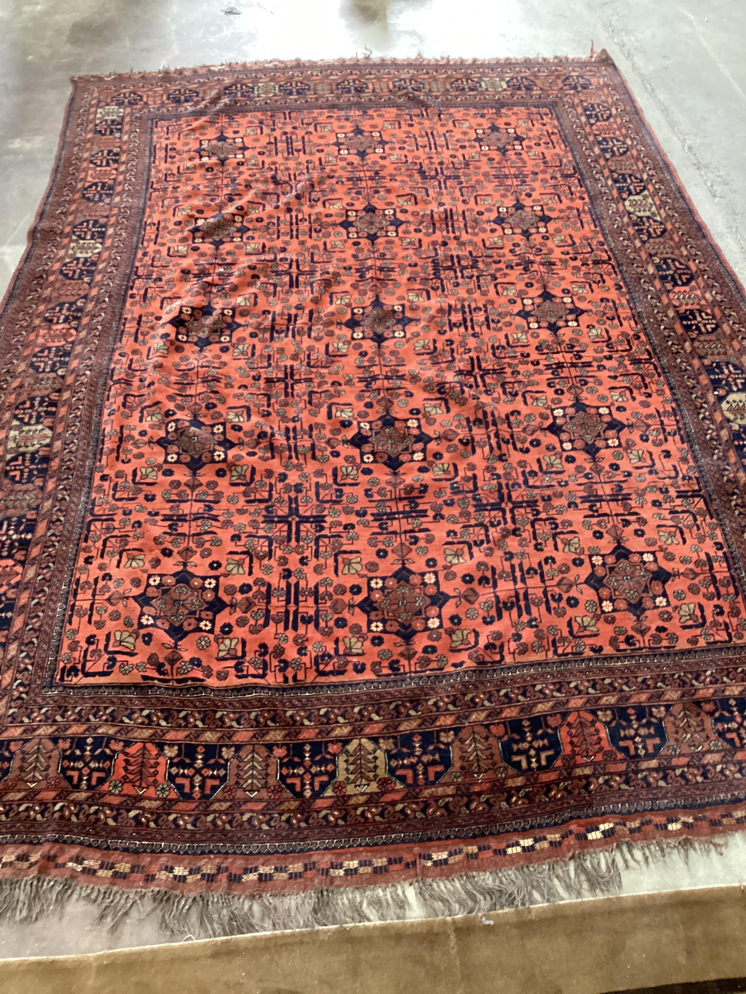 A Belouch red ground carpet, 344 x 235cm